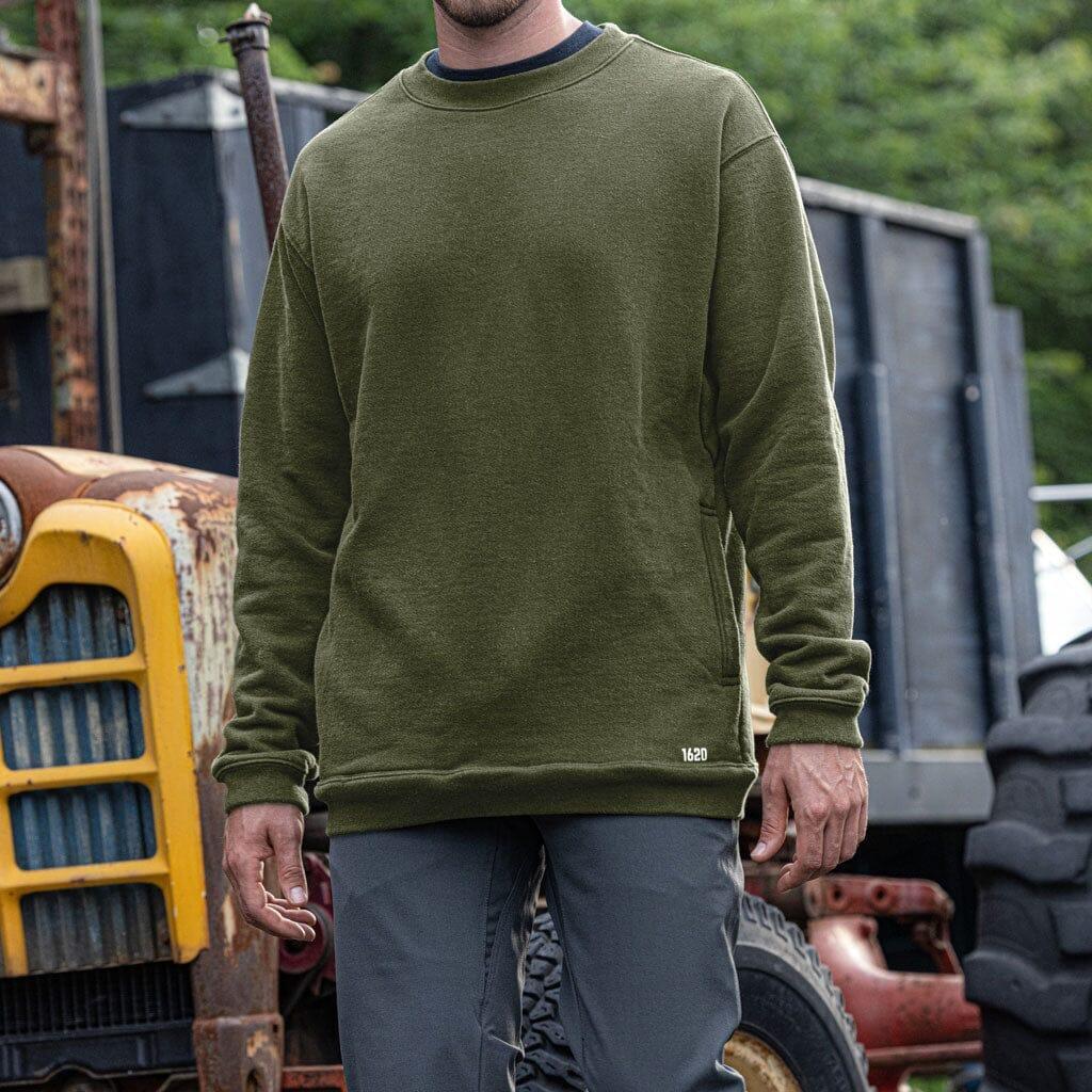 Male worker wearing The Crew Sweatshirt by 1620 Workwear in Hunter Green