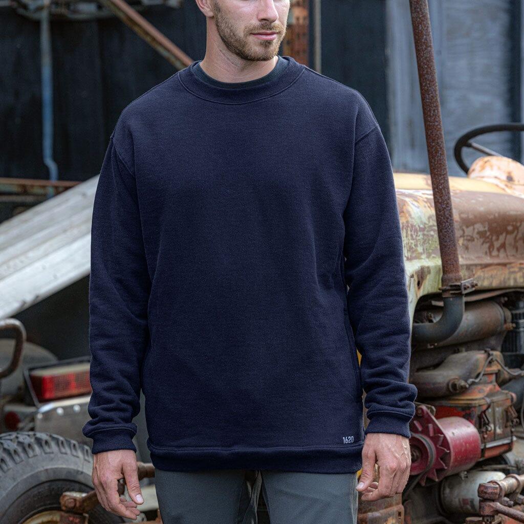 Male worker wearing The Crew Sweatshirt by 1620 Workwear in Uniform Blue