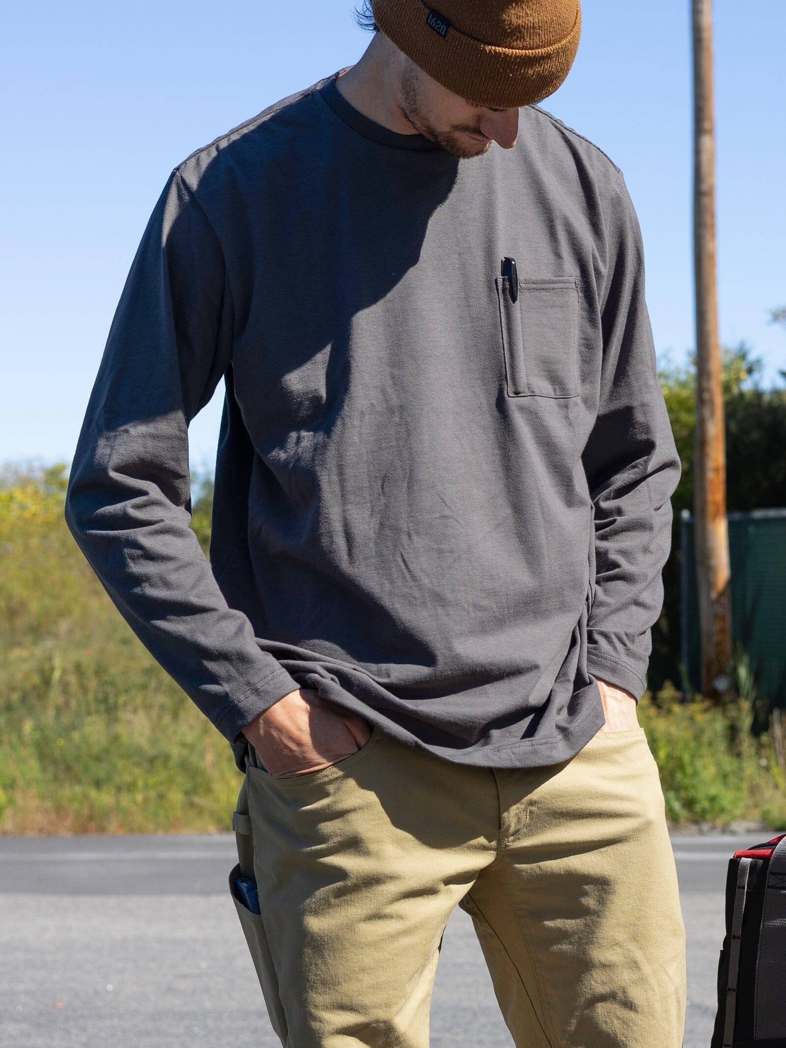 Worker wearing the 1620 Heavyweight NYCO Long Sleeve Pocket T-Shirt in gray, a pencil secured in the chest pocket slot