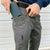 Grey DURASTRETCH® CARGO PANT featuring knife clip and welt device pocket with phone inside