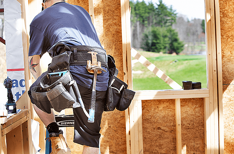 Black 1620 16d Utility Shorts worn by builder with tool belt on the job site