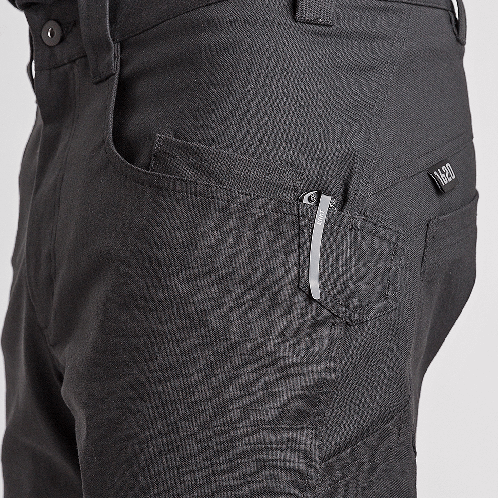 Black 1620 Single Knee Utility Pant featuring left hand knife clip and watch pocket, with knife inside