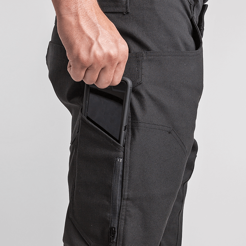 Black 1620 Double Knee Utility Pants featuring right hand phone pocket with phone inside 