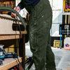 Worker wearing The Overall by 1620 Workwear in Hunter Green
